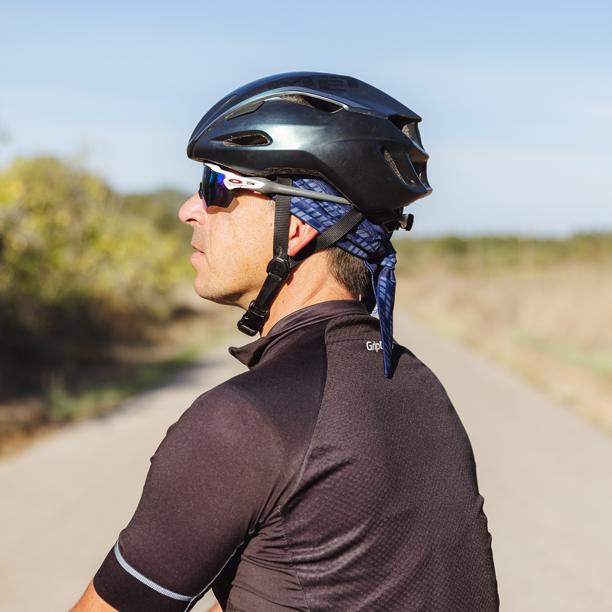 Bandana under top helmet